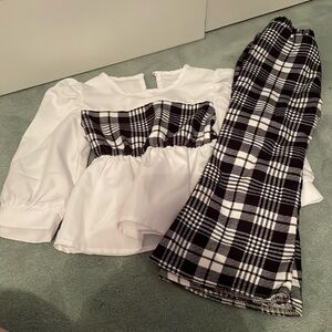 ADORABLE blouse and matching bell-bottom pants. Size 2T. ONLY WORN ONCE!